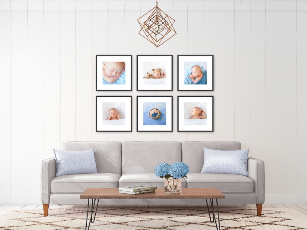Modern living room featuring a wall gallery of Pukekohe newborn photos above a cozy grey sofa.